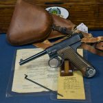 SOLD JAPANESE TYPE 14 NAMBU PISTOL.....18.4 DATE ( April, 1944 )........WITH HOLSTER AND BRINGBACK PAPERS...NICE