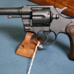 SOLD US WW2 COLT COMMANDO .38 SPEC. REVOLVER UN-ISSUED….NEW CONDITION STILL IN STORAGE GREASE…..DOCUMENTED ALABAMA GUARD GUN