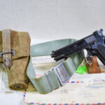 SOLD  FANTASTIC DOCUMENTED VIETNAM WAR TROPHY NVA OFFICERS FRENCH MAC 1950 PISTOL, WITH BELT, HOLSTER & ALL THE BRINGBACK DOCS IN DUPLICATE!