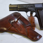 Sold 1944 NAZI OCCUPATION FN HIGH POWER PISTOL, VERY LATE “B” BLOCK, WITH LATE PLASTIC GRIPS, WITH HOLSTER, MINT!