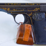SOLD VERY RARE FACTORY ENGRAVED FN LUXURY MODEL 1910 PISTOL, CIRCA 1926, WITH TYPE II FACTORY ENGRAVING, VERY NICE!