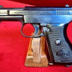 SOLD VERY SCARCE MODEL 1910/34 MAUSER PISTOL, THE “BABY” MODEL 1934, 6.35mm (.25 AUTO), WITH RARE BLACK PLASTIC BANNER GRIP, MINT CRISP!